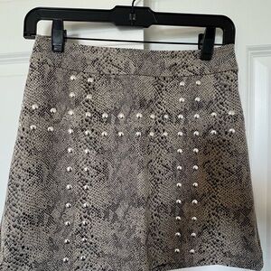 Stylish Snake Print Skirt with Metal Accents
